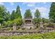 Stone entrance to Hadley Township with manicured landscaping at 109 Bridlington St, Sugar Hill, GA 30518