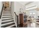 Welcoming entryway featuring staircase, hardwood floors, and stylish decor at 109 Bridlington St, Sugar Hill, GA 30518