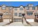 Charming brick townhomes with well-maintained landscaping and attached garages at 109 Bridlington St, Sugar Hill, GA 30518