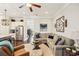 Open living space with a large sectional sofa and decorative wall art at 109 Bridlington St, Sugar Hill, GA 30518