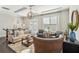 Comfortable living room with stylish decor, hardwood floors and cozy seating at 109 Bridlington St, Sugar Hill, GA 30518