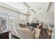 Elegant living room featuring natural light, modern furnishings and neutral color palette at 109 Bridlington St, Sugar Hill, GA 30518