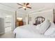 Spacious primary bedroom with four poster bed and ensuite bath at 109 Bridlington St, Sugar Hill, GA 30518