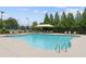 Community swimming pool with chairs and landscaping at 109 Bridlington St, Sugar Hill, GA 30518