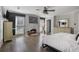 A spacious main bedroom features hardwood floors and a whitewashed brick fireplace at 2083 Fairhaven Ne Cir, Atlanta, GA 30305