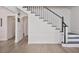 A home staircase with black railing and white trim is accented by hardwood floors at 2083 Fairhaven Ne Cir, Atlanta, GA 30305