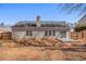 Backyard view of the home with a stone patio and fenced yard at 441 Concord Cir, Mcdonough, GA 30253
