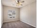 Bedroom with neutral walls, carpet flooring, a window and a ceiling fan with lighting at 441 Concord Cir, Mcdonough, GA 30253