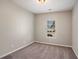 Bedroom featuring neutral walls, carpet flooring, a window and a light fixture at 441 Concord Cir, Mcdonough, GA 30253