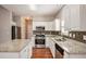 Spacious kitchen with granite countertops, stainless steel appliances, and a center island at 441 Concord Cir, Mcdonough, GA 30253