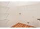 Bright laundry room with vinyl floor and wire shelving at 441 Concord Cir, Mcdonough, GA 30253