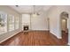Bright living room with a fireplace, hardwood floors, and large windows at 441 Concord Cir, Mcdonough, GA 30253