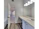 Bright bathroom with a vanity, new flooring, and good lighting at 45 Kirkland Ct, Covington, GA 30016