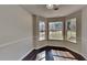 Bright breakfast nook featuring a bay window offering scenic views and hardwood flooring at 45 Kirkland Ct, Covington, GA 30016