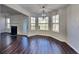 Open-concept dining area featuring stylish chandelier and hardwood flooring at 45 Kirkland Ct, Covington, GA 30016