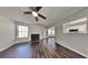 Inviting living room featuring a cozy fireplace, hardwood floors, and natural light at 45 Kirkland Ct, Covington, GA 30016