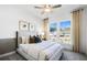 Cozy bedroom with a comfortable bed, carpet flooring, and natural light from the window at 3136 Morris Hills Dr, Dacula, GA 30019