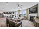 Open-concept living room and kitchen with hardwood floors, fireplace, and modern decor at 3136 Morris Hills Dr, Dacula, GA 30019