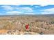 Scenic aerial view of a charming neighborhood nestled among trees with distant mountains at 511 Millwood Ct, Canton, GA 30114