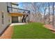 Backyard with lawn and patio under deck at 511 Millwood Ct, Canton, GA 30114