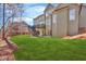 Lush green backyard with a view of the home's deck and lower level access, perfect for outdoor enjoyment at 511 Millwood Ct, Canton, GA 30114