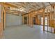 Unfinished basement space with wood framing and concrete floor at 511 Millwood Ct, Canton, GA 30114