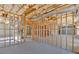 Spacious unfinished basement with exposed ceiling, stud walls and concrete floor, ready to be customized at 511 Millwood Ct, Canton, GA 30114