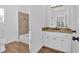 Well-lit bathroom with a granite countertop, tile backsplash and a combined tub and shower at 511 Millwood Ct, Canton, GA 30114