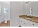 A pristine bathroom vanity with a granite countertop and a stylish faucet fixture at 511 Millwood Ct, Canton, GA 30114