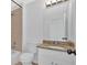 Bathroom with granite countertop and white cabinets at 511 Millwood Ct, Canton, GA 30114