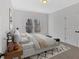 Comfortable bedroom with a large window, soft carpet, and stylish furniture at 511 Millwood Ct, Canton, GA 30114
