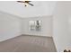 Inviting bedroom with neutral carpet, large window and modern ceiling fan at 511 Millwood Ct, Canton, GA 30114