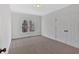 A sunlit bedroom with fresh carpet and a large closet for ample storage space at 511 Millwood Ct, Canton, GA 30114