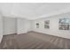 Spacious bedroom with neutral carpet, tray ceiling and large windows at 511 Millwood Ct, Canton, GA 30114