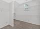 Walk-in closet with multiple shelves and a window for natural light at 511 Millwood Ct, Canton, GA 30114