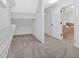 Spacious walk-in closet with ample shelving and neutral carpeting at 511 Millwood Ct, Canton, GA 30114