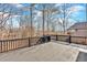 Spacious outdoor deck overlooking beautiful natural wooded views and distant homes at 511 Millwood Ct, Canton, GA 30114