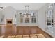 Open dining room with hardwood floors and lots of natural light from surrounding windows at 511 Millwood Ct, Canton, GA 30114