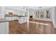 Open kitchen with stainless steel appliances, granite counters, and hardwood floors at 511 Millwood Ct, Canton, GA 30114