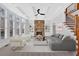 Open living room with coffered ceilings, fireplace, built-ins, and a spiral staircase at 511 Millwood Ct, Canton, GA 30114