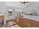 Open concept floorplan with fireplace, hardwood floors and open kitchen at 511 Millwood Ct, Canton, GA 30114