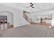 Open concept living space flowing into kitchen with breakfast nook and staircase at 511 Millwood Ct, Canton, GA 30114