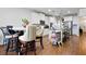 Bright kitchen featuring a center island, white cabinets, stainless steel appliances, and a cozy dining area at 555 Birkdale Dr, Fairburn, GA 30213
