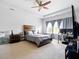 Spacious primary bedroom with tray ceilings, ceiling fan, and a workstation at 555 Birkdale Dr, Fairburn, GA 30213