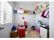 Storage room with shelving units containing toys and household items at 555 Birkdale Dr, Fairburn, GA 30213