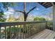 A wooden balcony with gray railing overlooking a scenic view with green foliage at 213 Tuxworth Cir, Decatur, GA 30033
