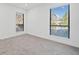 Bright, carpeted bedroom featuring large window and natural light at 213 Tuxworth Cir, Decatur, GA 30033