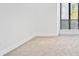 Clean bedroom space with neutral carpet and large window at 213 Tuxworth Cir, Decatur, GA 30033