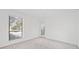 Cozy bedroom features neutral carpeting and a view of the outdoors at 213 Tuxworth Cir, Decatur, GA 30033