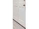 Close-up of a white door with gold hardware and light gray flooring at 213 Tuxworth Cir, Decatur, GA 30033
